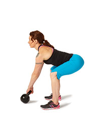 A woman performs a kettlebell two-hand swing.