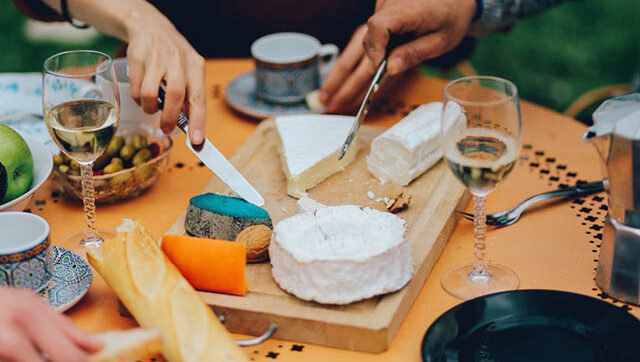 Group of people eating a avariety of cheese