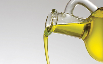olive oil pouring from jar
