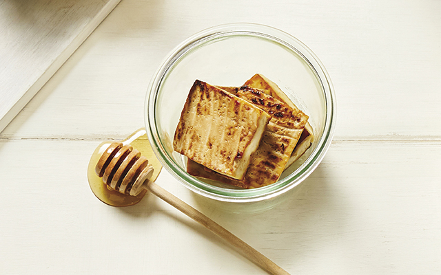 a glass bowl with Honey Tamari Roasted Tofu