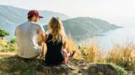 A couple talking atop a hill