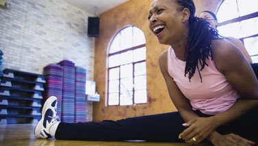 person laughing in fitness studio