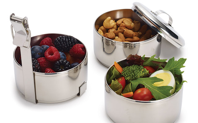 Three stainless-steel containers of food are shown.