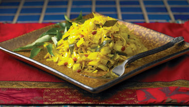 Sauteed cabbage with ginger and lentils is pictured on a plate.