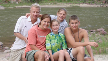 family by river
