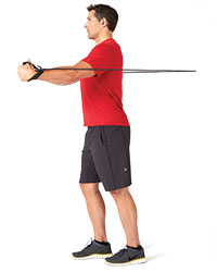 A man performs a resistance band fly.