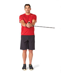 A man performs a resistance-band reverse lunge, first picture.