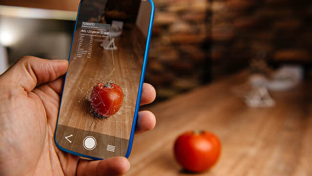 Picture of a tomato on a smart phone