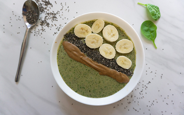 A peanut-butter-and-banana smoothie bowl topped with blueberries