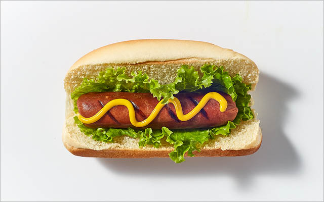 Soy hot dog with lettuce, mustard and a bun