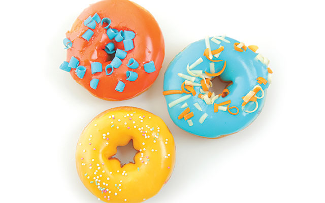 A trio of brightly colored doughnuts