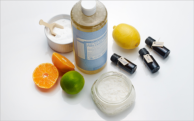 a bottle of castille, citrus fruit, and oils