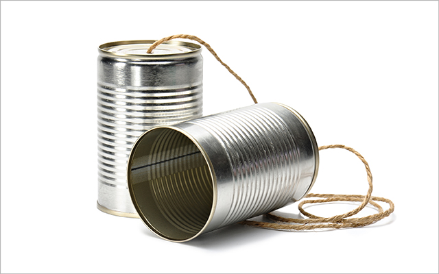 two tin cans with a string connecting them