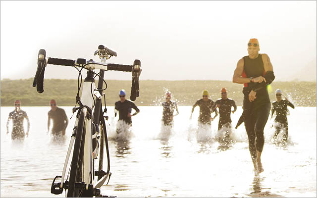 Triathletes running out of water to bike