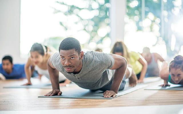 Group fitness class in push-up position