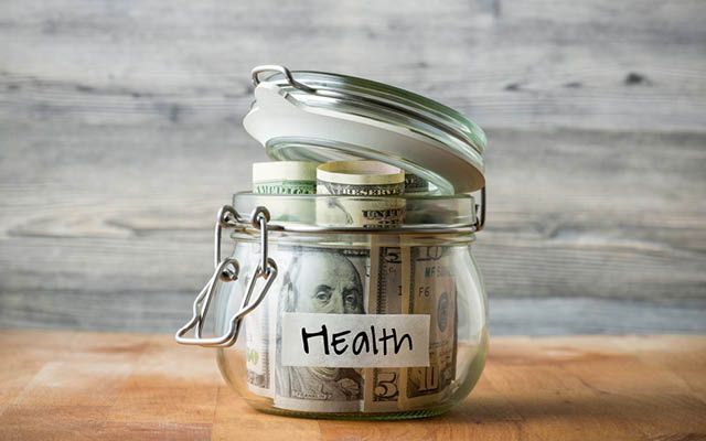 Jar full of money that says "health"