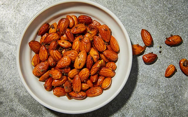 A bowl of curry-roasted almonds