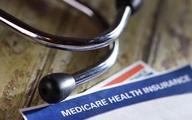 A picture of a stethoscope and a Medicare form