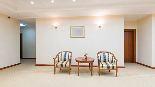 Two chairs in a bleak office space