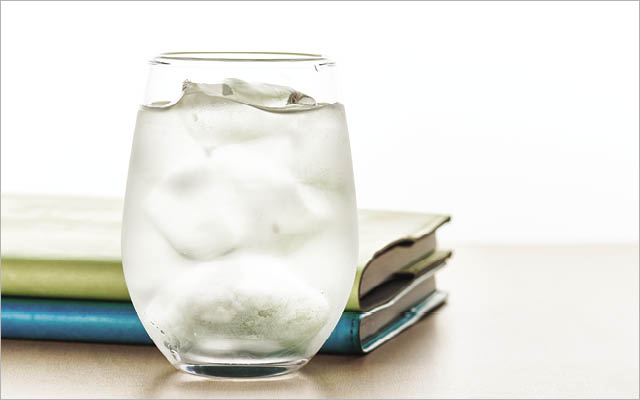 glass of water with books