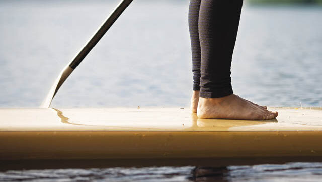 Person standing on stand-up paddleboard