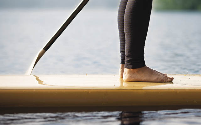 Person standing on stand-up paddleboard