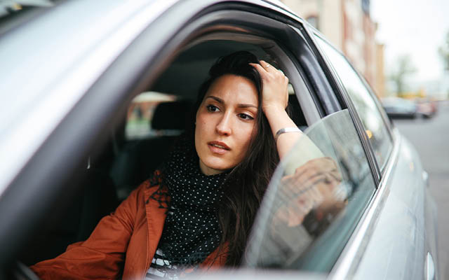 A woman stuck in traffic