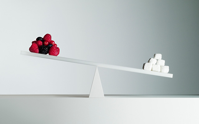 Scale of fruits and sugar cubes
