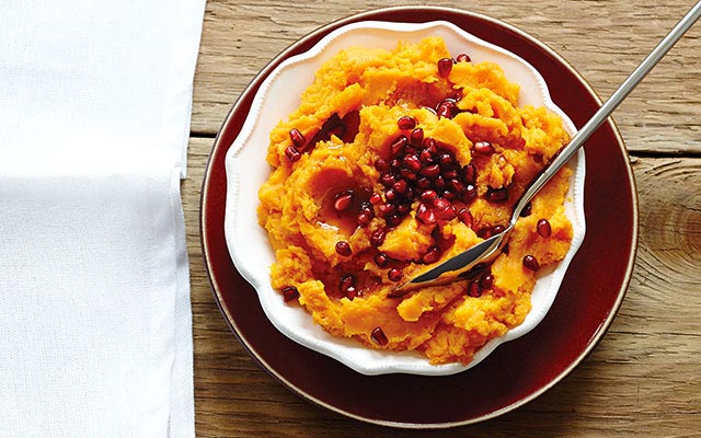 Mashed sweet potatoes topped with pomegranate seeds