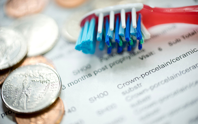 toothbrush, money, and dental bill