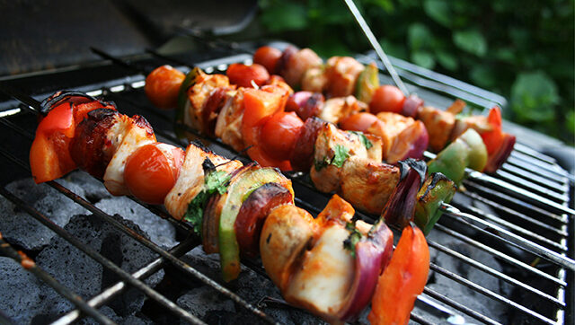 A selection of BBQ skewers on the grill