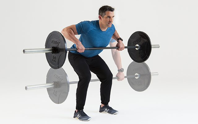 Man holding a barbell exercising