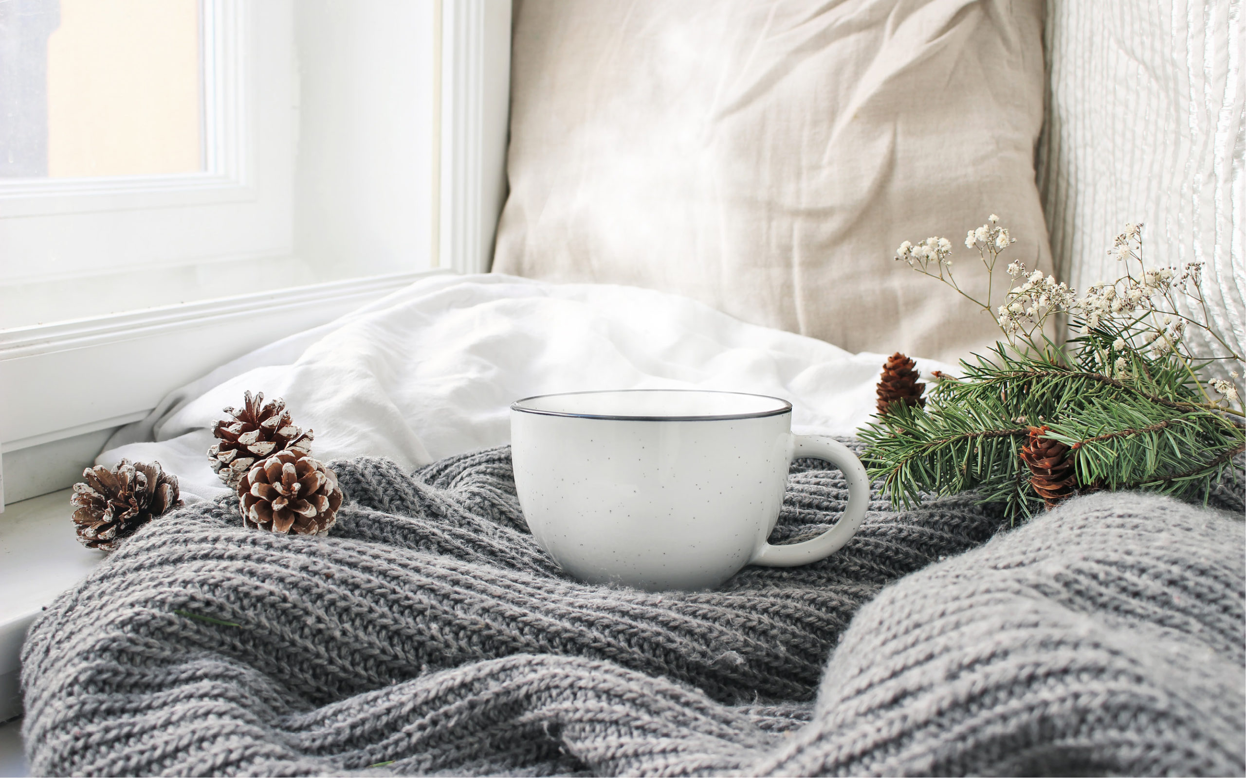 Coffee cup and cozy blanket
