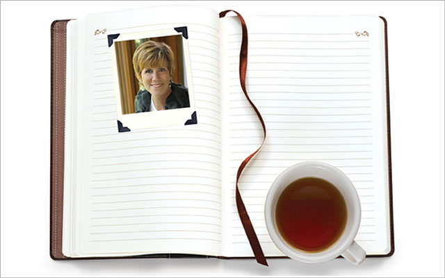 Notebook, coffee, head shot of Kate Larsen