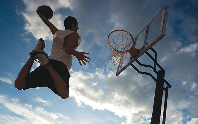 Man dunking a basketball