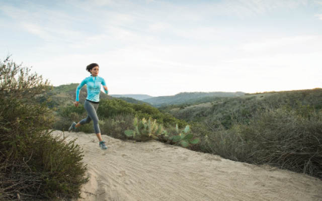 Woman running on a trail