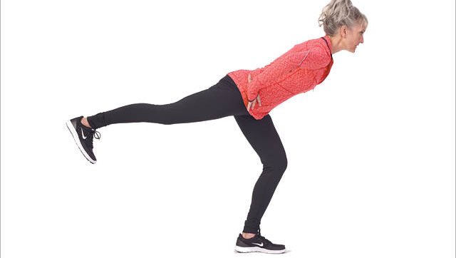 a woman performs the single leg deadlift