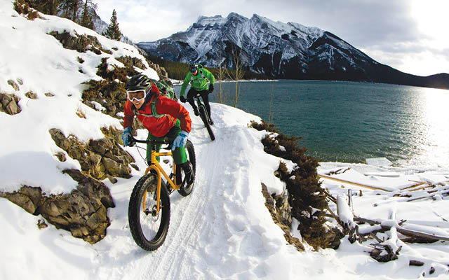 Biking on snowy mountain