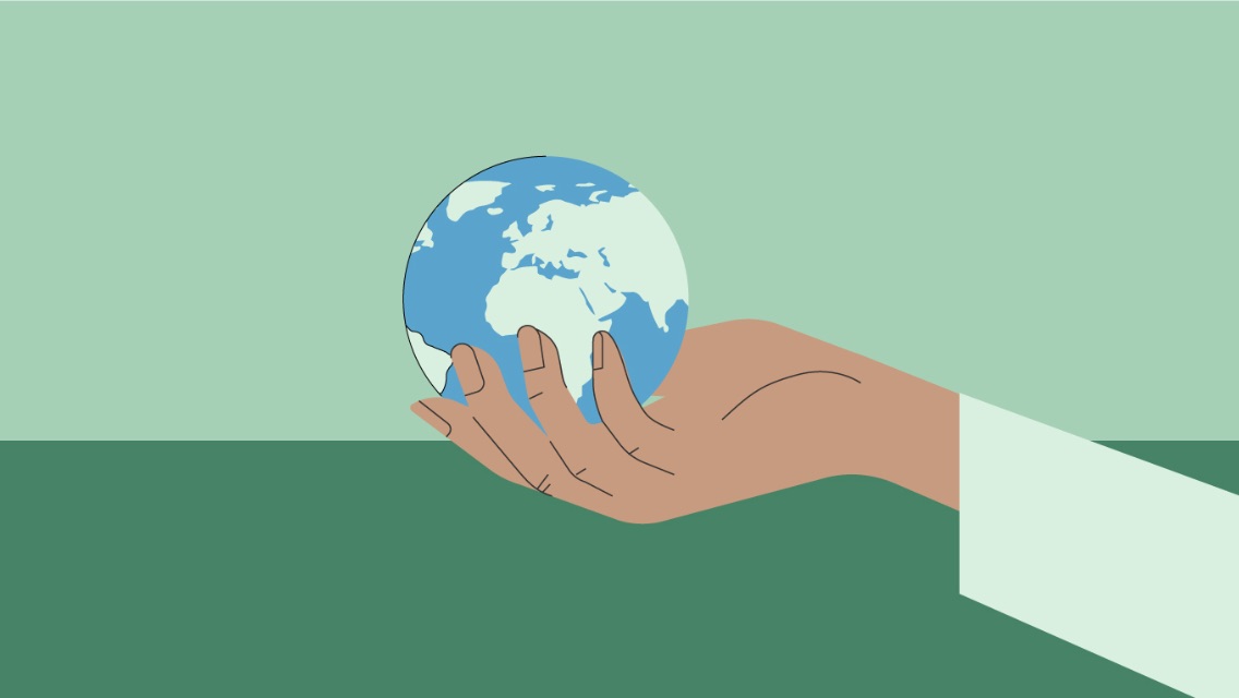 An illustration of a person's hand holding the earth.