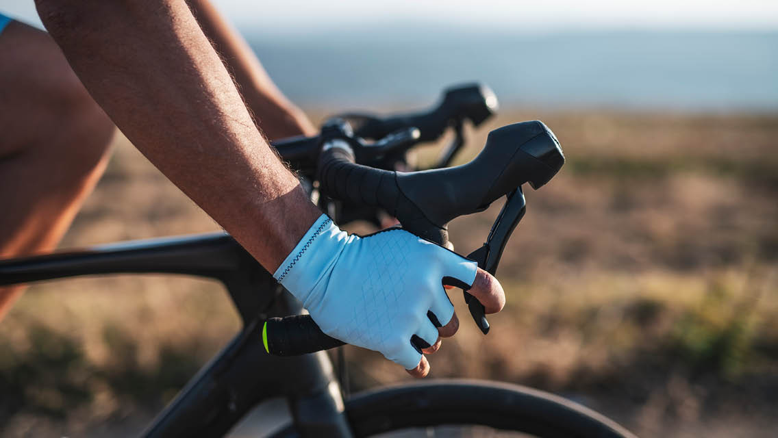 close up of hands on a bicycle