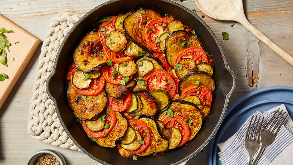 a cast iron skillet with ratatouille