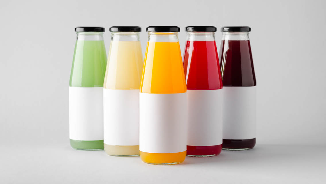 bottles filled with colorful liquid with plain white label