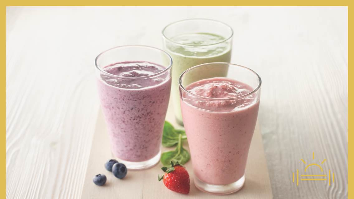 Glasses of three different smoothies.