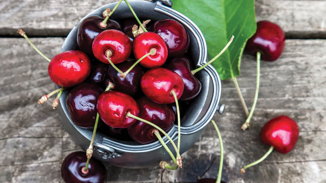 a bowl filled with cherries