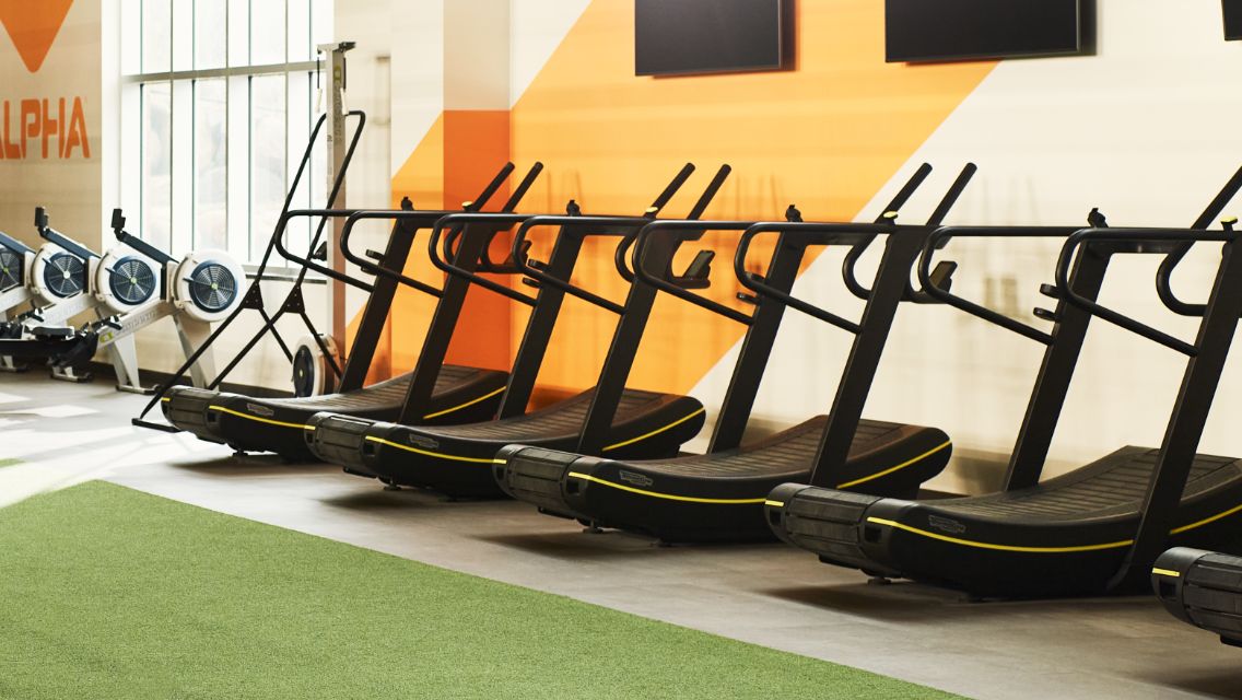 A row of Skillmill machines in a Life Time health club.