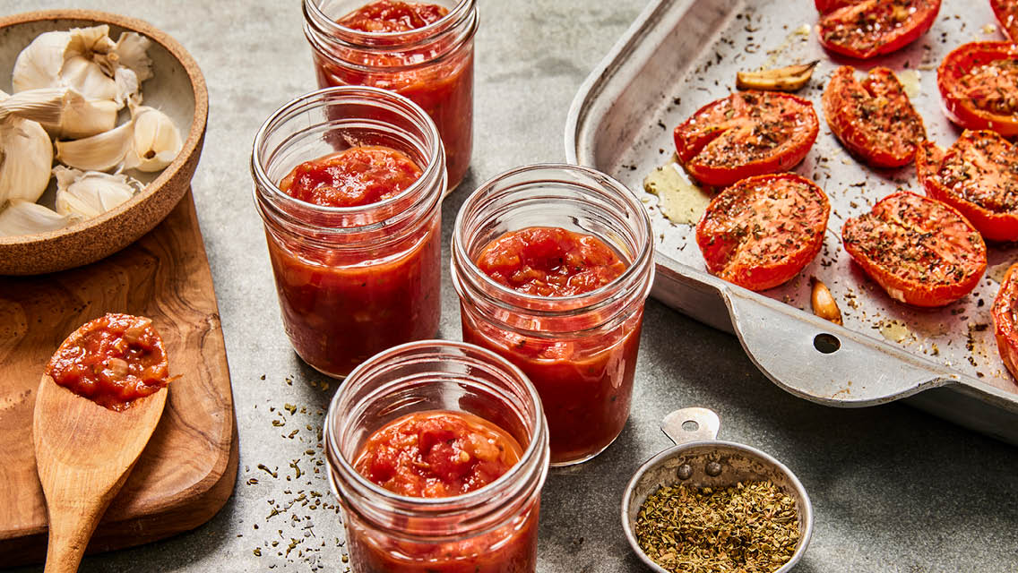 canning jars filled with roasted tomato sauce
