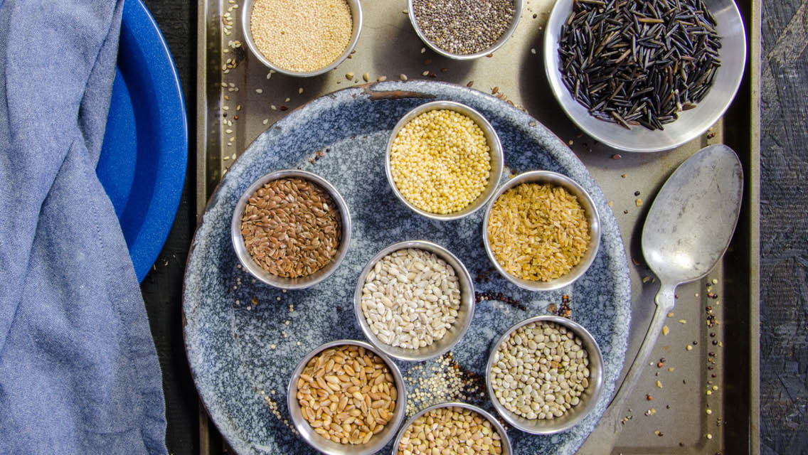 a variety of ancient grains in bowls