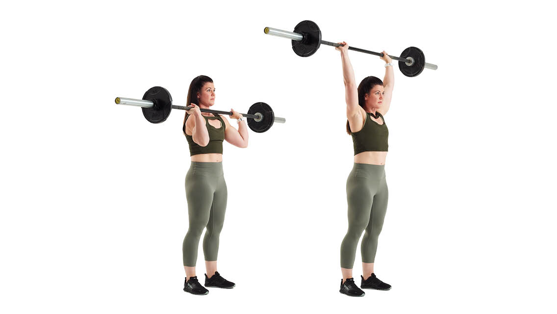 a woman performs an overhead press with a barbell