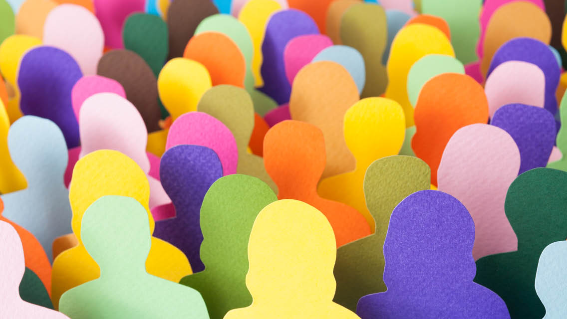 colorful cutouts of people shapes in a group