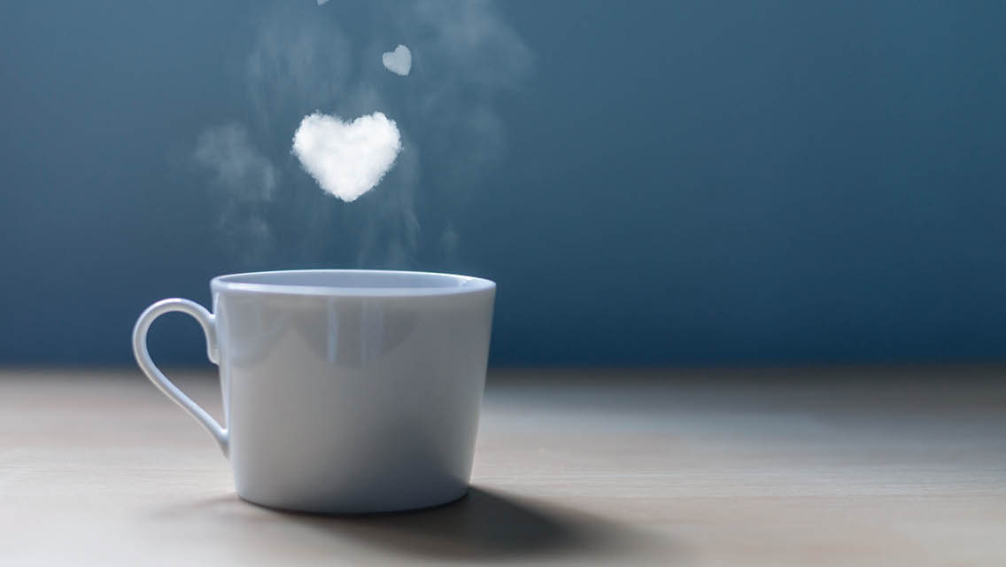 a coffee cup with a steam heart above